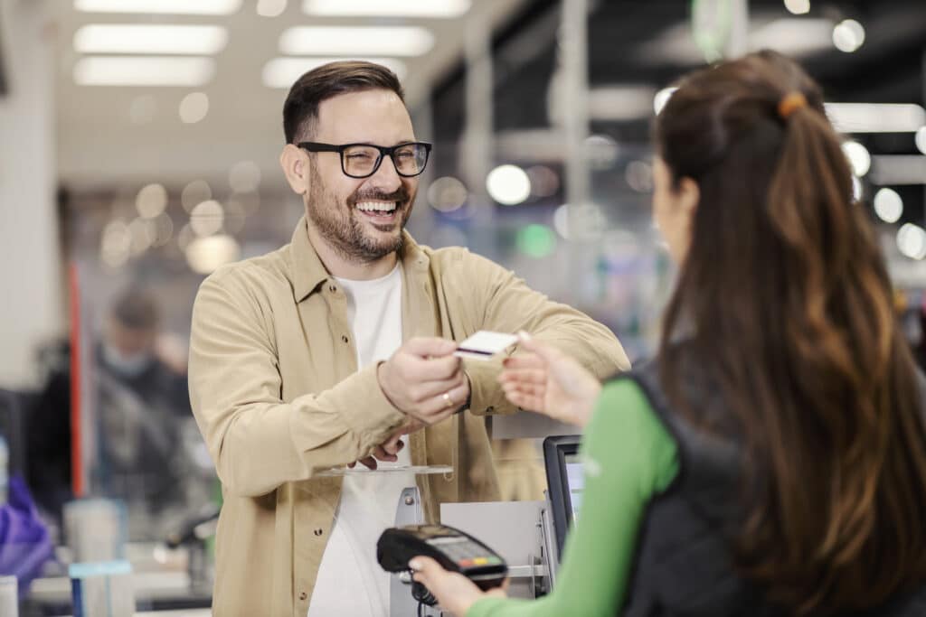 Man paying with a card at a store