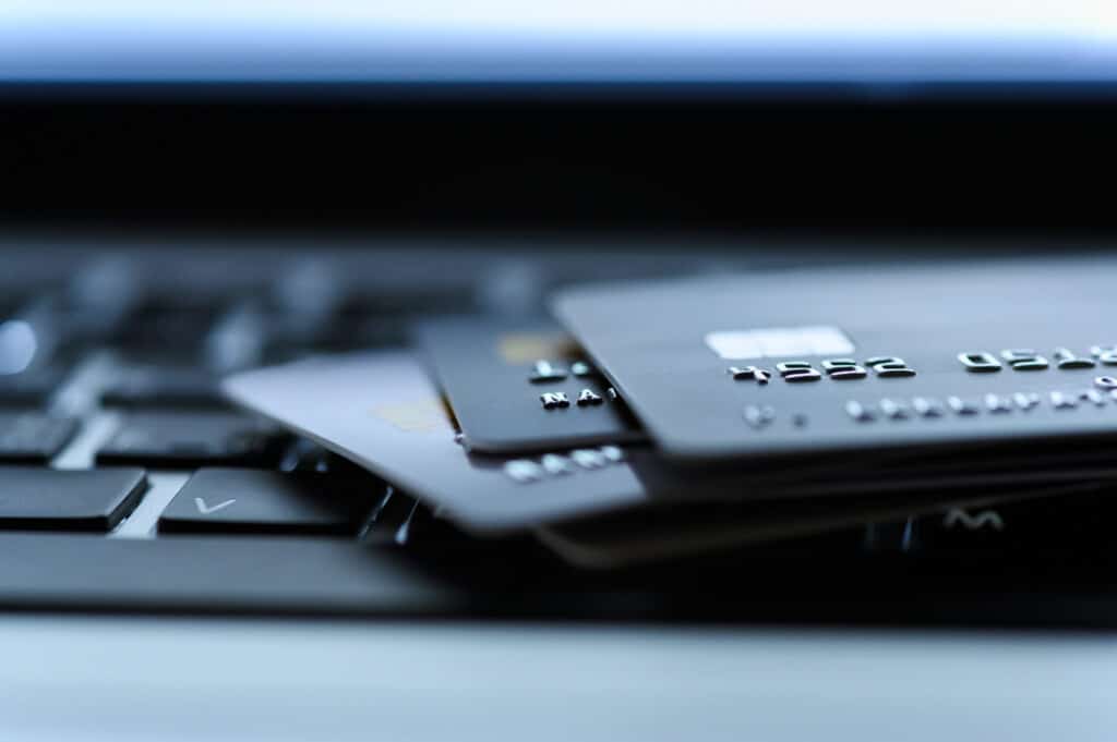 how to choose the right credit card. Close up shot of credit card on Laptop computer payment for purchases from online stores and online shopping. Concept of internet purchase. Selective focus for background.