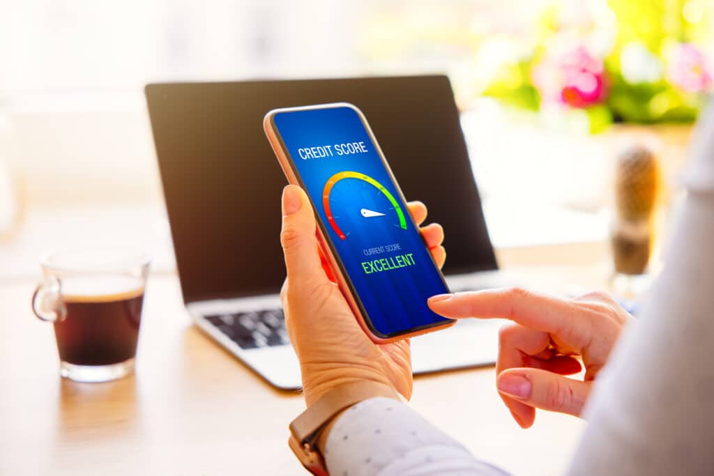 Experian credit score. Woman looking at her credit score result on mobile phone