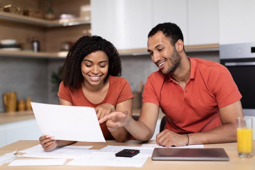 young black couple navigating how to split finances when living together