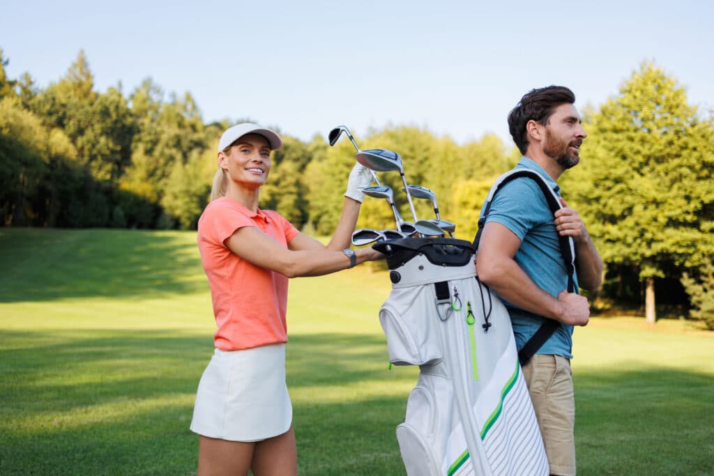 golf course with man and woman walking