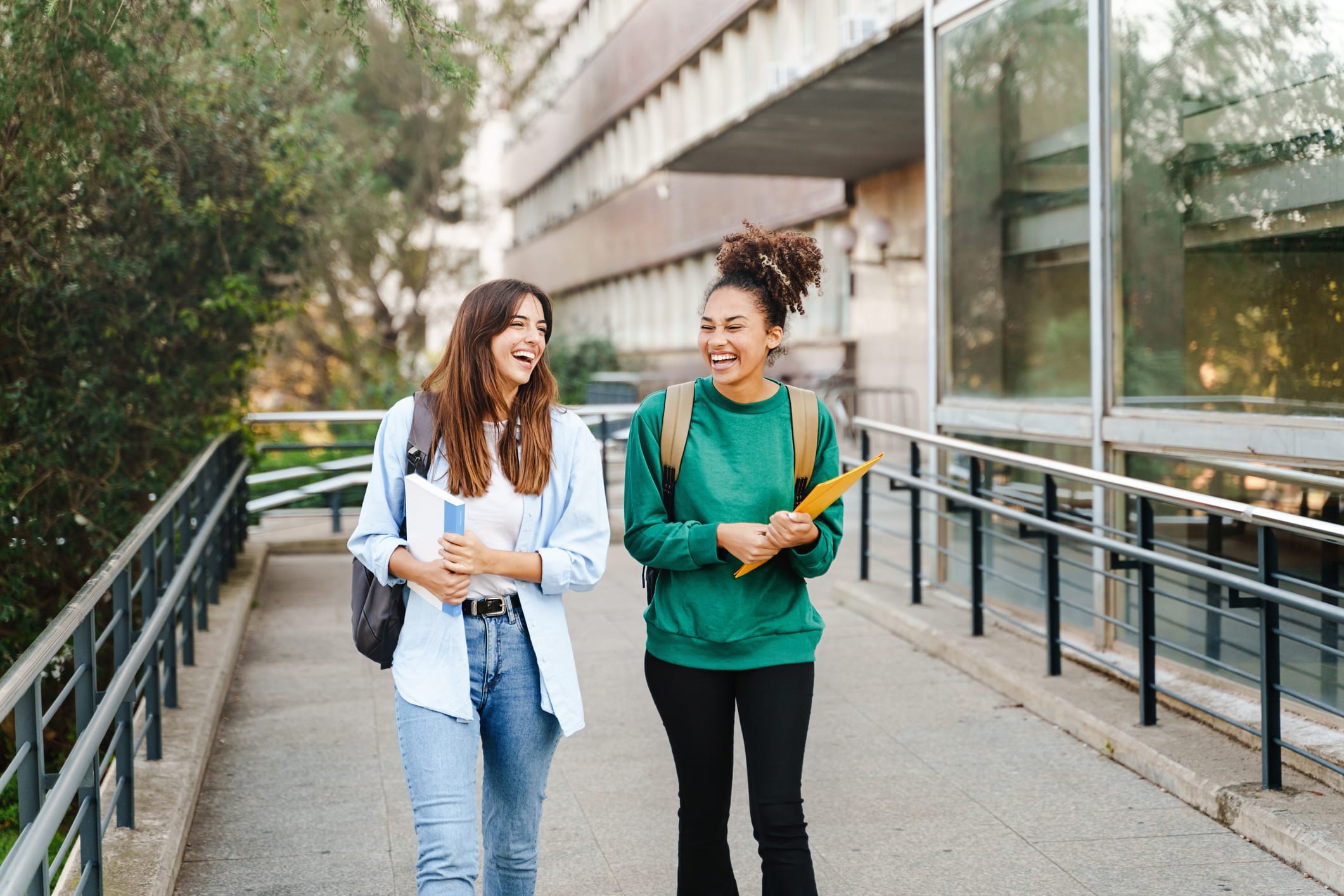 college budget—two friends walking on campus.