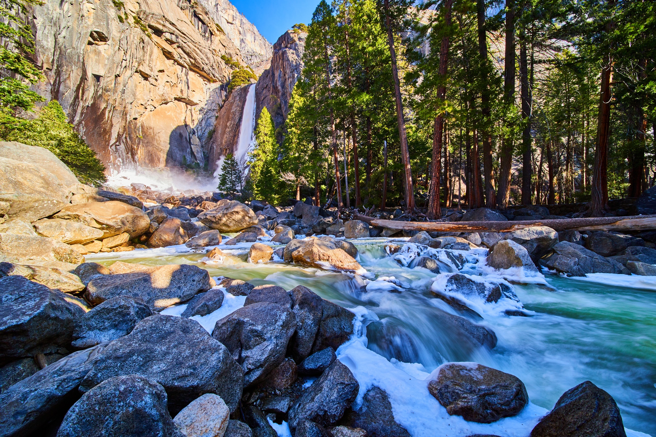 Affordable trip idea: Yosemite national park. river with granite mountains and trees in background.