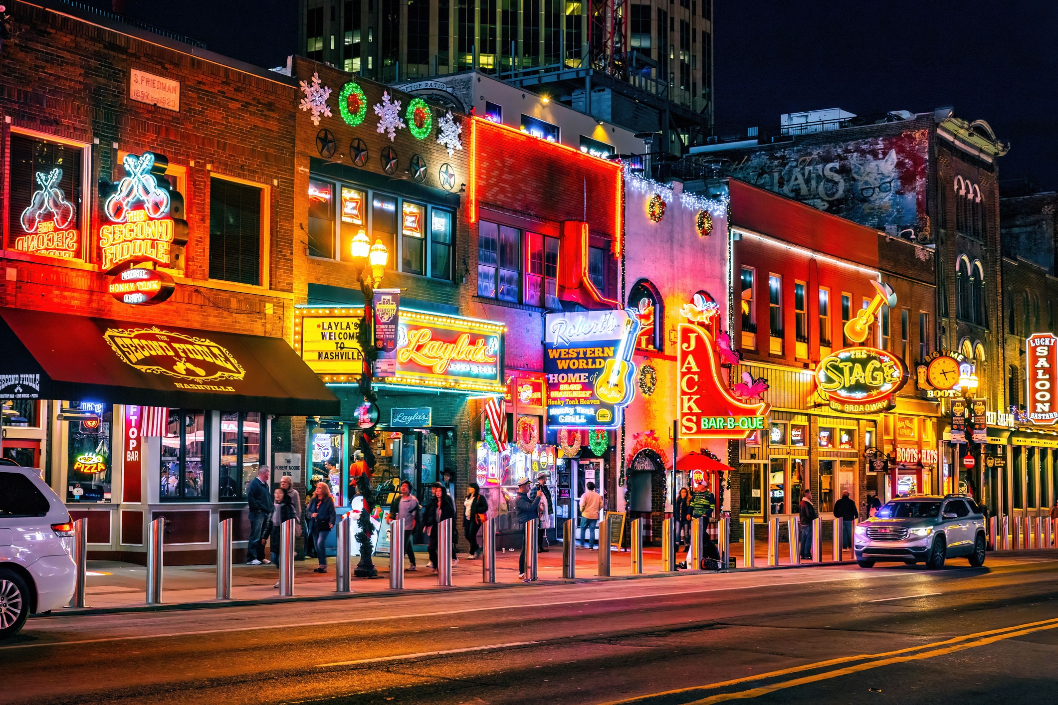 Affordable travel idea: Famous Neon signs on Beale street illuminated at night in downtown Nashville
