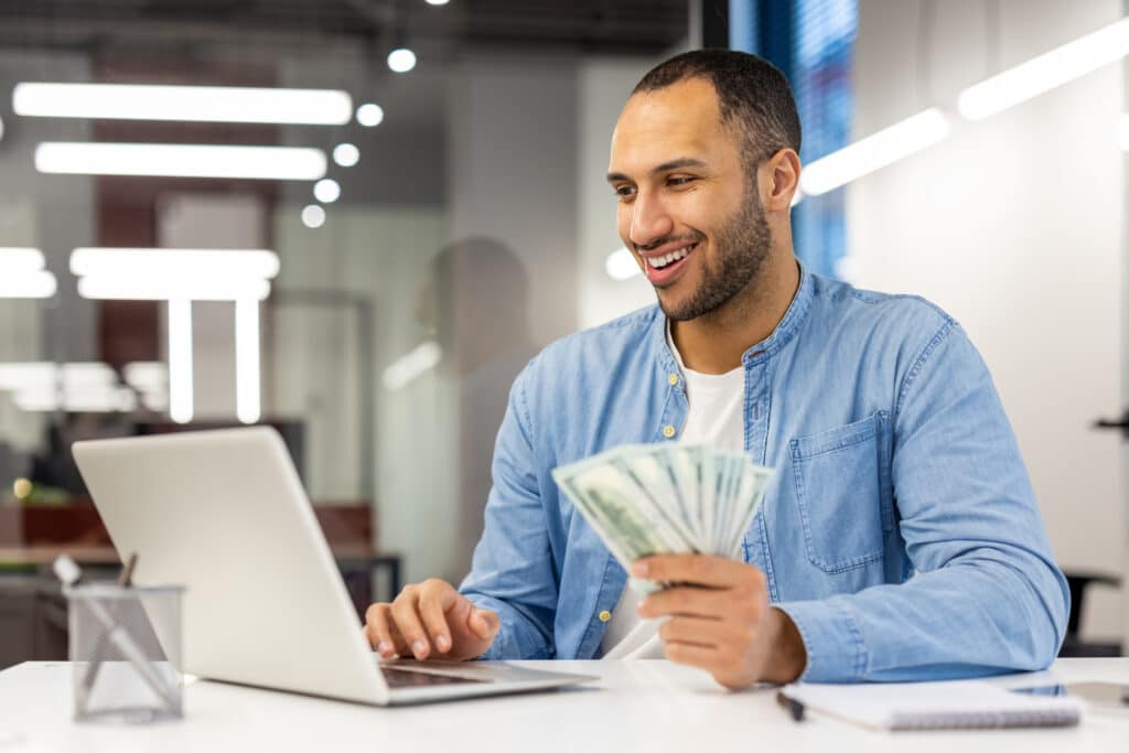 Passive income, man at computer.