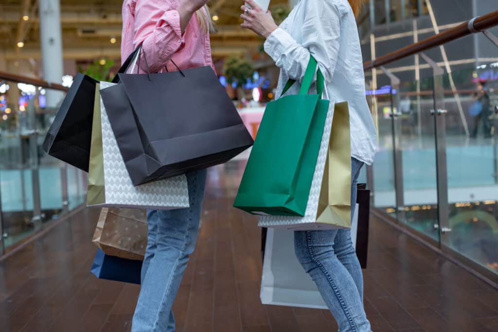 Two people with lots of shopping bags